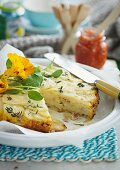 Potato tortilla with nasturtium flowers