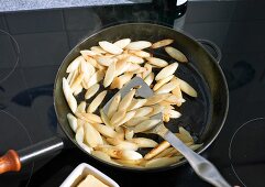 Asparagus being cooked in a pan