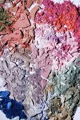 Crumbled powder, eye shadow and rouge in various colours