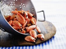 Cooked prawns in a colander