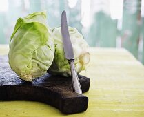 Pointed cabbage on a chopping board