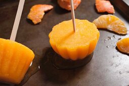 Homemade orange ice lollies