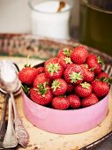Fresh strawberries in an enamel pot