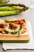 Asparagus wrapped in bacon with cheese