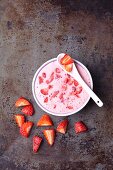 Strawberry yoghurt ice cream with fresh strawberry pieces