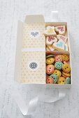 Biscuits shaped like buttons and love-hearts in gift box