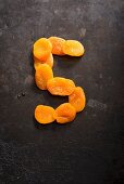 The number 5 made from dried apricots
