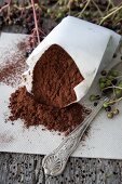 A paper bag of cocoa powder with elderberries