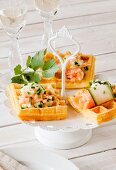 Potato waffles with a spicy salmon and cucumber topping
