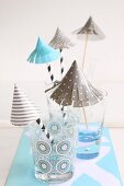 Hand-crafted paper umbrellas as decorations for party drinks