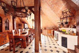 Rustic, Medieval-style kitchen with vaulted ceiling, solid wooden dining set, tiled floor with dark accent tiles