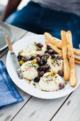 Baked ricotta with an olive salad