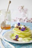 Green apple salad with celery, pecan nuts and honey