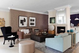 Various upholstered furnishings around wooden coffee table in open-plan living room