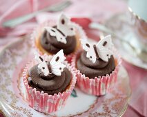 Dark chocolate cupcakes with fondant butterflies
