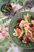 Pasta salad with salmon, asparagus, raspberries and a lemon vinaigrette