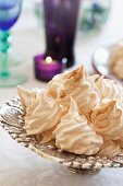 Cinnamon meringues on a silver stand