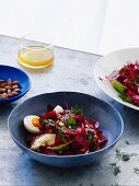 Beetroot salad with hard-boiled egg, avocado and smoked almonds