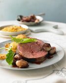 Sauerbraten (marinated pot roast) from milk-fed lamb in a sorrel marinade with caramelised onions and potato gratin