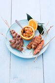 Papaya and orange chutney with chicken and veal skewers