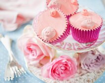Pink cupcakes decorated with pigs