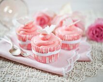 Strawberry cream cupcakes decorated with butterflies