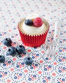 A raspberry, blueberry and banana cupcake
