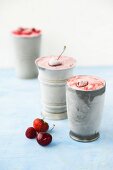 Strawberry ice cream, cherry ice cream and raspberry ice cream in metal cups