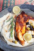 Grilled sturgeon with olives and lemon