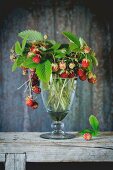 Ripe strawberries in a vintage glass