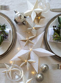 Handmade origami Christmas stars on table