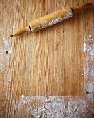 A floured wooden work surface and a rolling pin