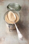 Breadcrumbs in a jar with a spoon