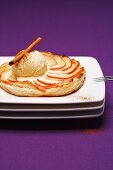 Apple tart with vanilla ice cream and cinnamon