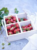 Strawberries in a segregated wooden box