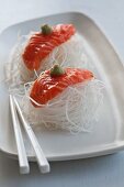 Salmon sashimi on radish strips with wasabi