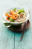 Oriental noodle soup with prawns and vegetables