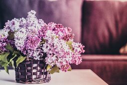 Bouquet of lilacs against wooden background