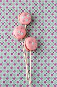 Macaroon lollies decorated with edible paper