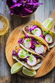 Taco shells with chicken and radishes (Mexico)