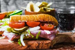 Ham, gherkin and tomato sandwich
