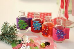 Mini vases with homemade, felt Christmas covers