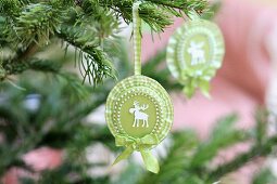 Hand-crafted rosettes with moose motifs and ruffled ribbon; Christmas tree decorations