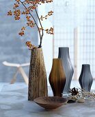 A collection of decorative vases in brown and grey tones
