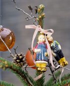 Hansel and Gretel baubles decorating the top of a Christmas tree