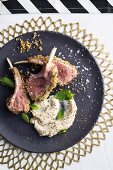 Lamb chops with a lemon and rosemary crust, bean purée and mint