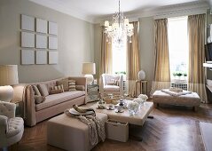 Tea service on ottoman and pale beige seating in traditional living room