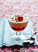 Trifle with glace cherries and flaked almonds