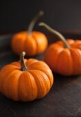 Three orange mini pumpkins