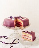 Raspberry cake with a purple marzipan coating